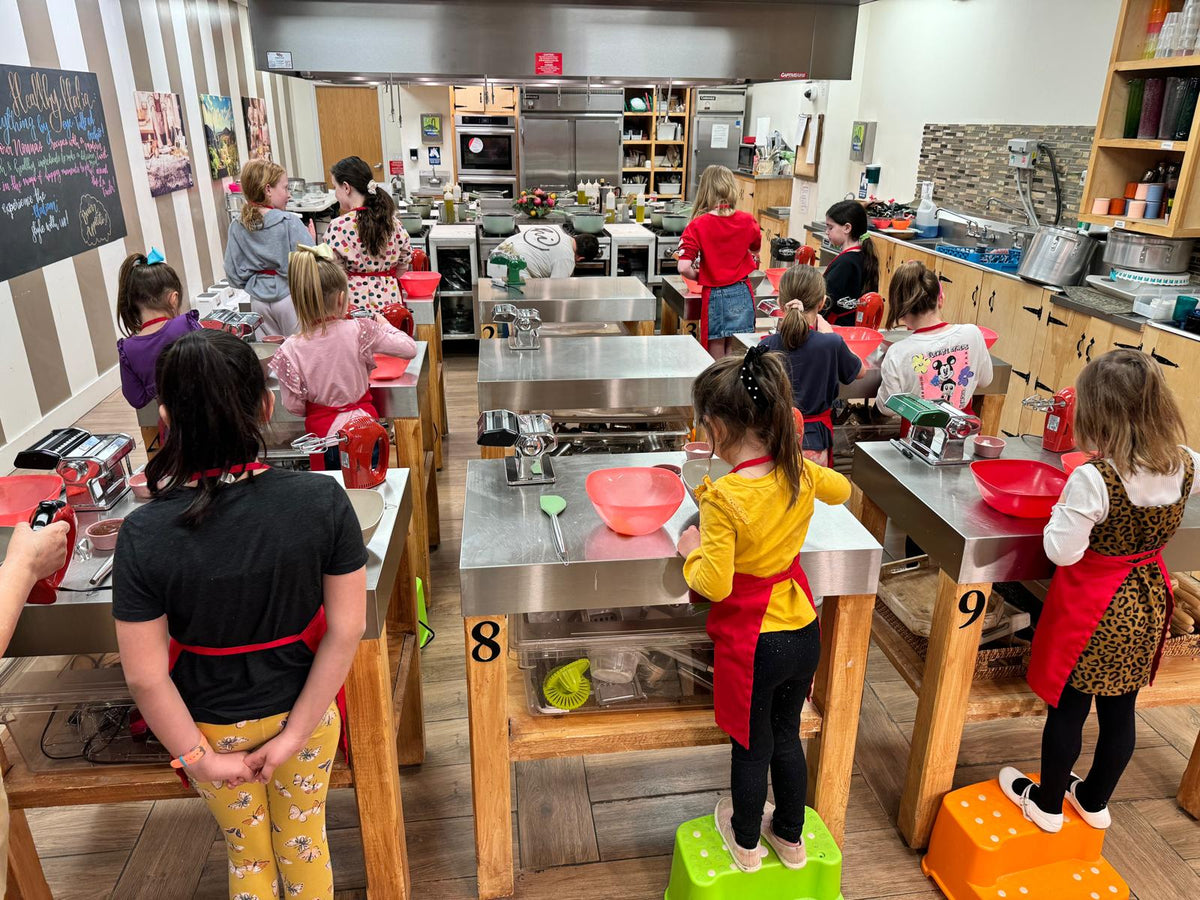 Guests cooking together in the Healthy Italia kitchen