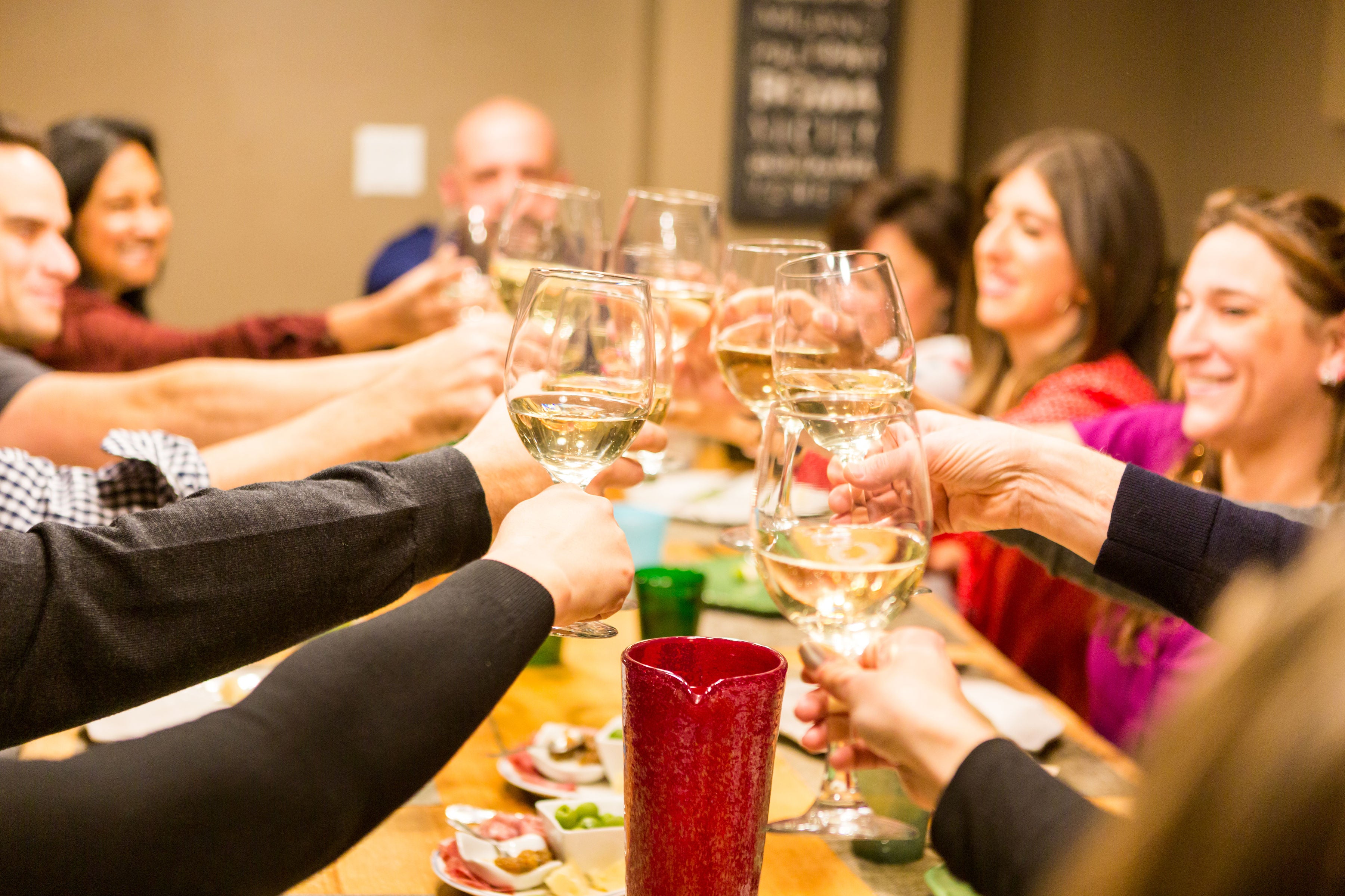 Guests celebrating around the table at Healthy Italia